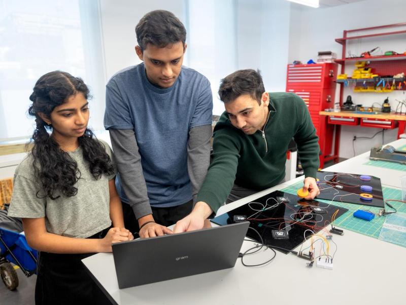 Student teams working on prototypes in Max Zhang's Internet of Things class in Upson Hall